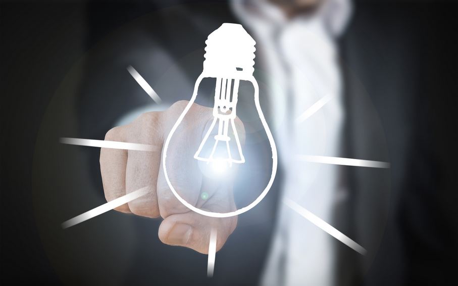 Image of finger pointing to a light bulb