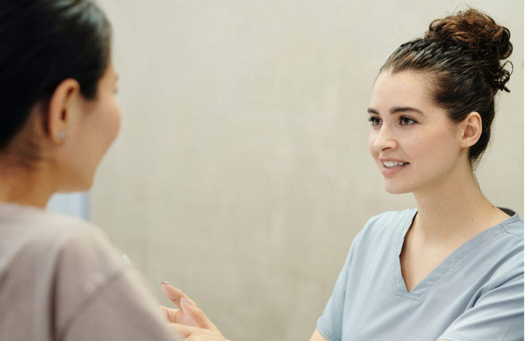 Image of a nurse speaking to a patient