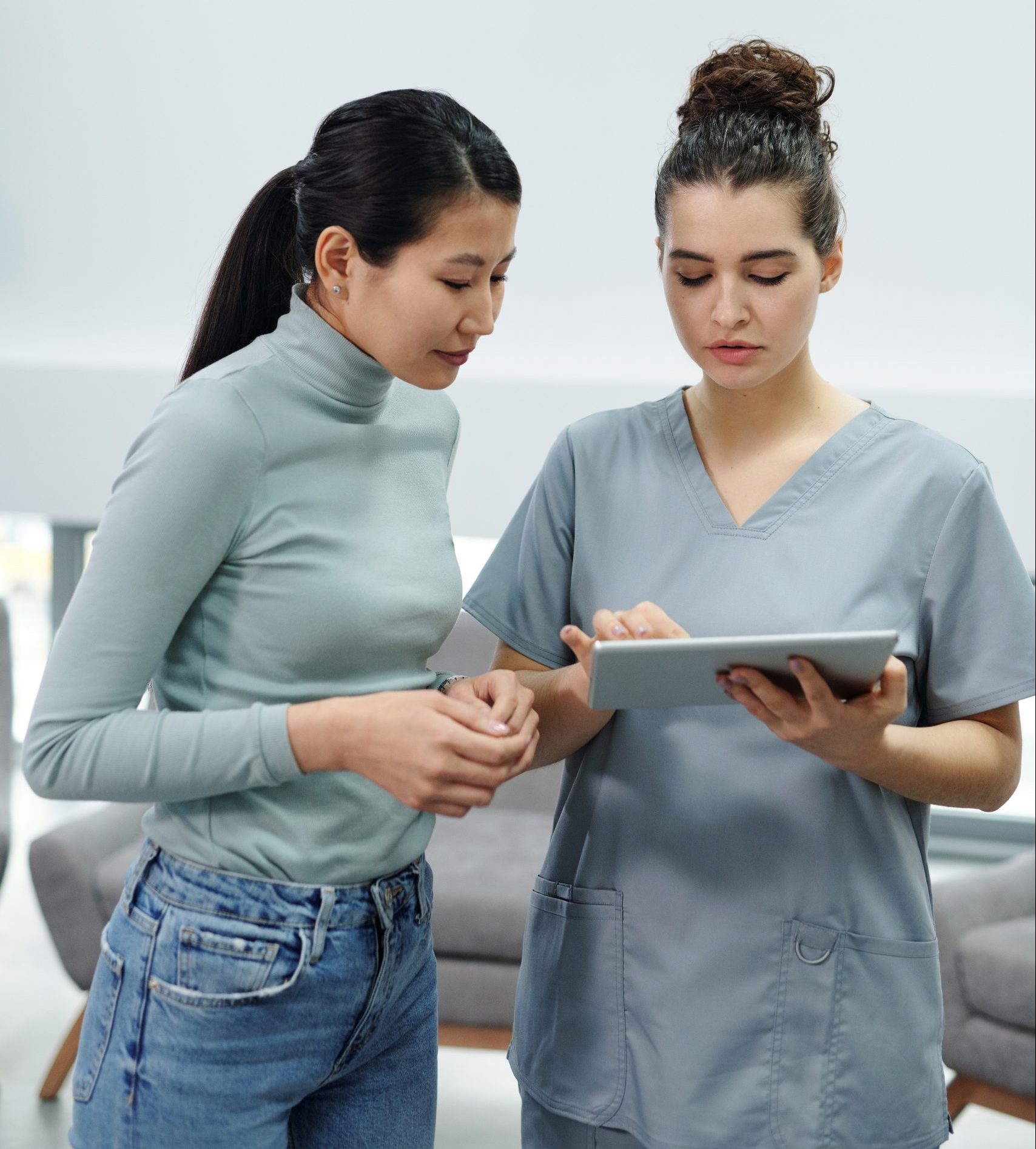 Image of two nurses discussing patients results