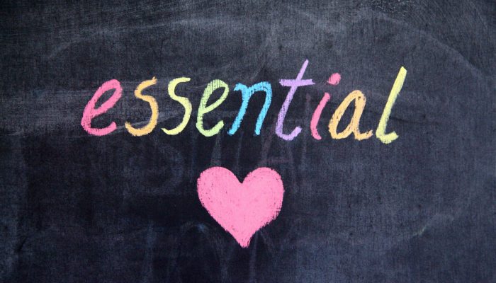 Image with word essential written on a black board