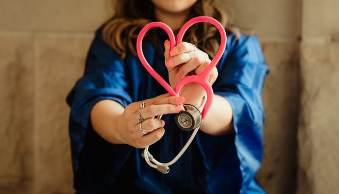 Image of a nurse holding a stethoscope