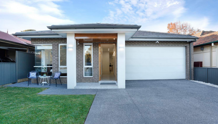 Image of front of a house with an opened door